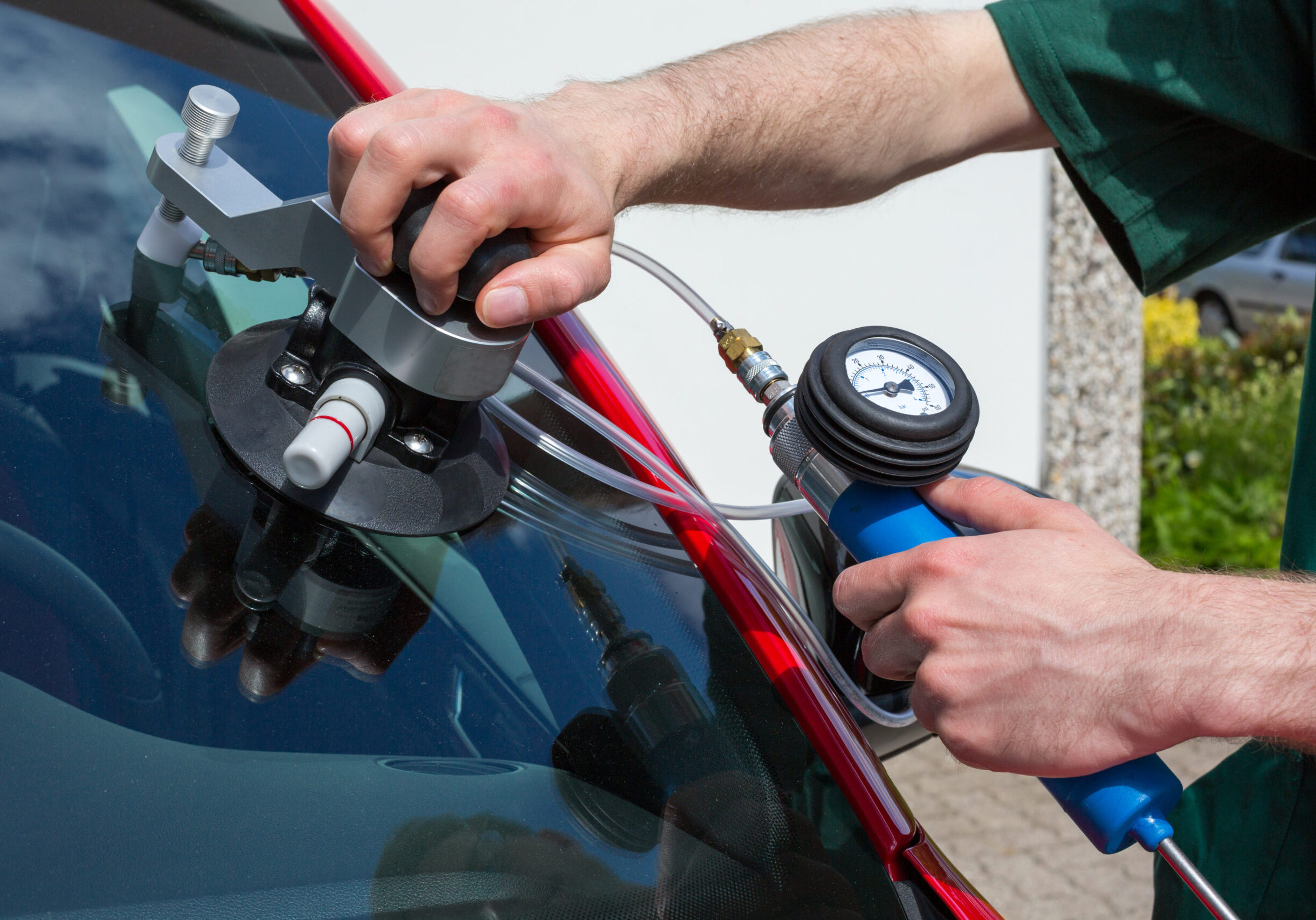Glazier,Repairing,Windshield,On,A,Car,After,Stone-chipping,Damage